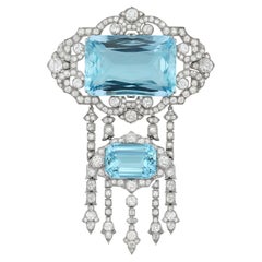 An aquamarine and diamond brooch by Hennell, 9x6cm, 55.9 grams