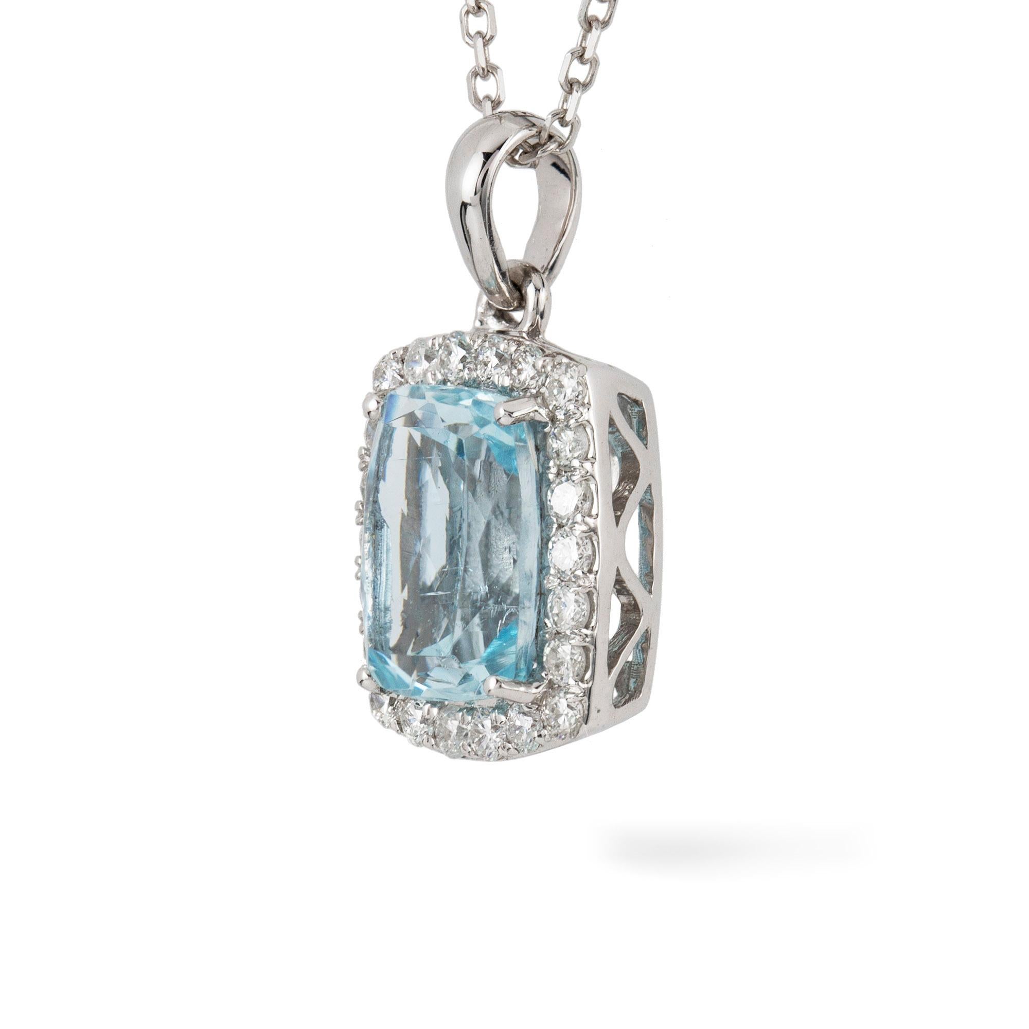 An aquamarine and diamond cluster pendant, the four claw set rectangular mix cut aquamarine weighing 1.25ct surrounded by a cluster of diamond weighing a total of 0.70ct, all suspended by an pendant loop, hallmarked 750, Sheffield, the pendant