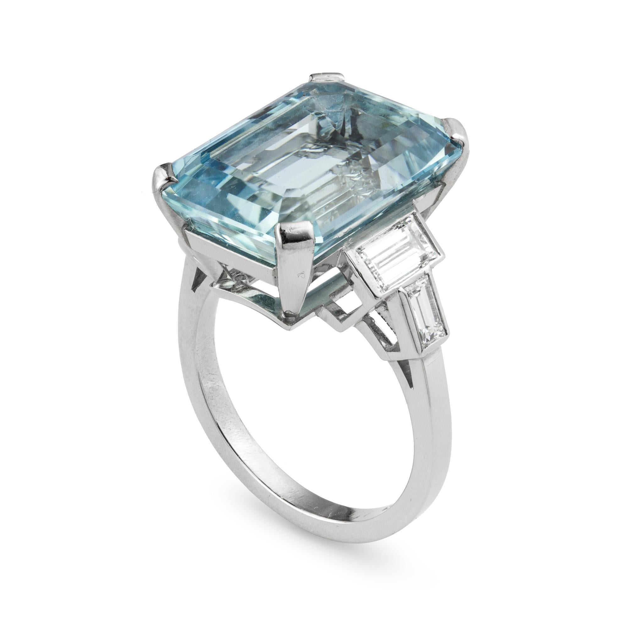 An aquamarine and diamond ring, the emerald-cut aquamarine weighing 12.01 carats, claw-set between baguette diamond-set shoulders, with total diamond weight 0.96 carats, all mounted in platinum, hallmarked platinum, London 2017, made by Bentley &