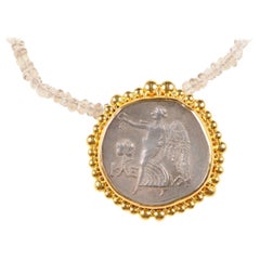 An AR Tetradrachm [Coin] Nike Pendant trimmed in 22k Gold (pendant only)