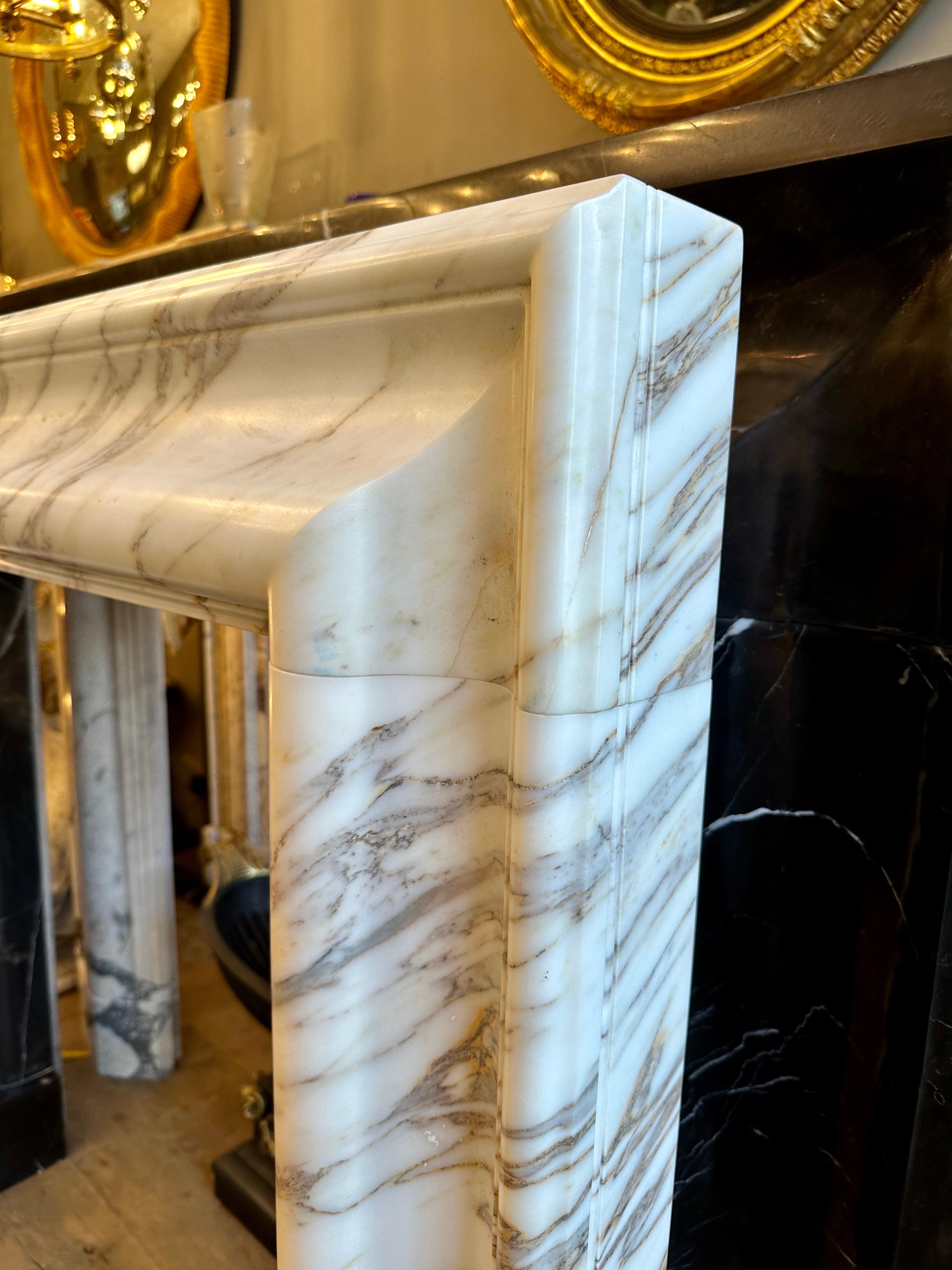 English An Arabescato Marble Bolection Fireplace Mantle  For Sale