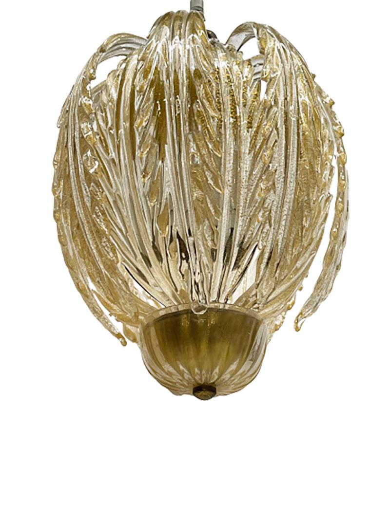 An Archimede Seguso Murano chandelier pendant lamp, Italy 1940

An Italian Murano glass chandelier pendant lamp, designed by Archimede Seguso ca 1940 with 2 rows of glass leaf-shaped ornaments. The glass has 24 carat gold flakes. Model Lampada