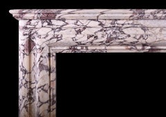 An architectural English marble fireplace in Breche Violette marble