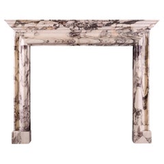 An Architectural Fireplace in Breche Violette Marble