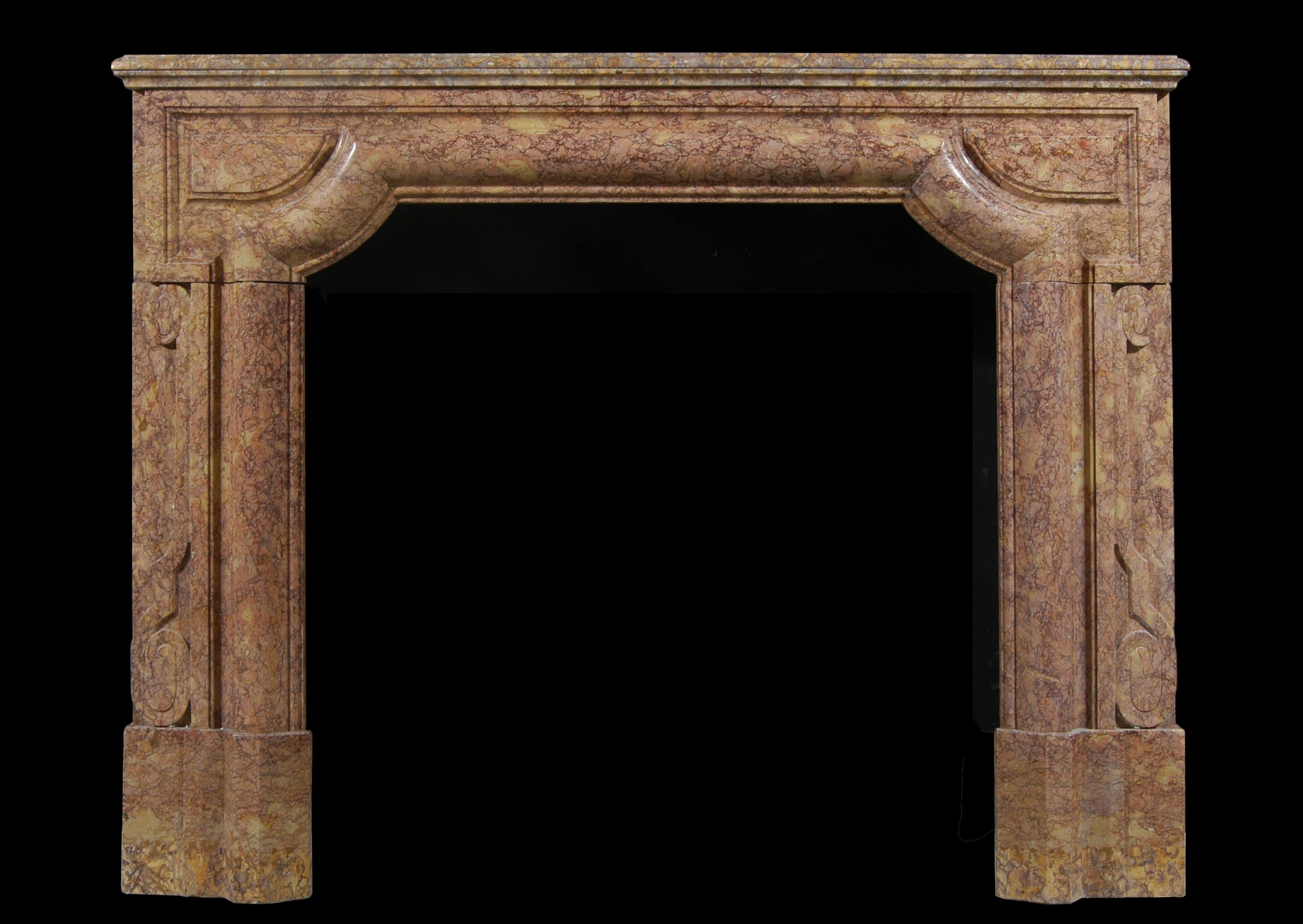 An architectural French fireplace in Brocatelle marble. The shaped frieze surmounted by moulded shelf. The legs with scrollwork throughout. 19th century.

Shelf Width:	1465 mm      	57 ⅝