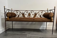 An architectural hand-forged wrought iron hallway bench