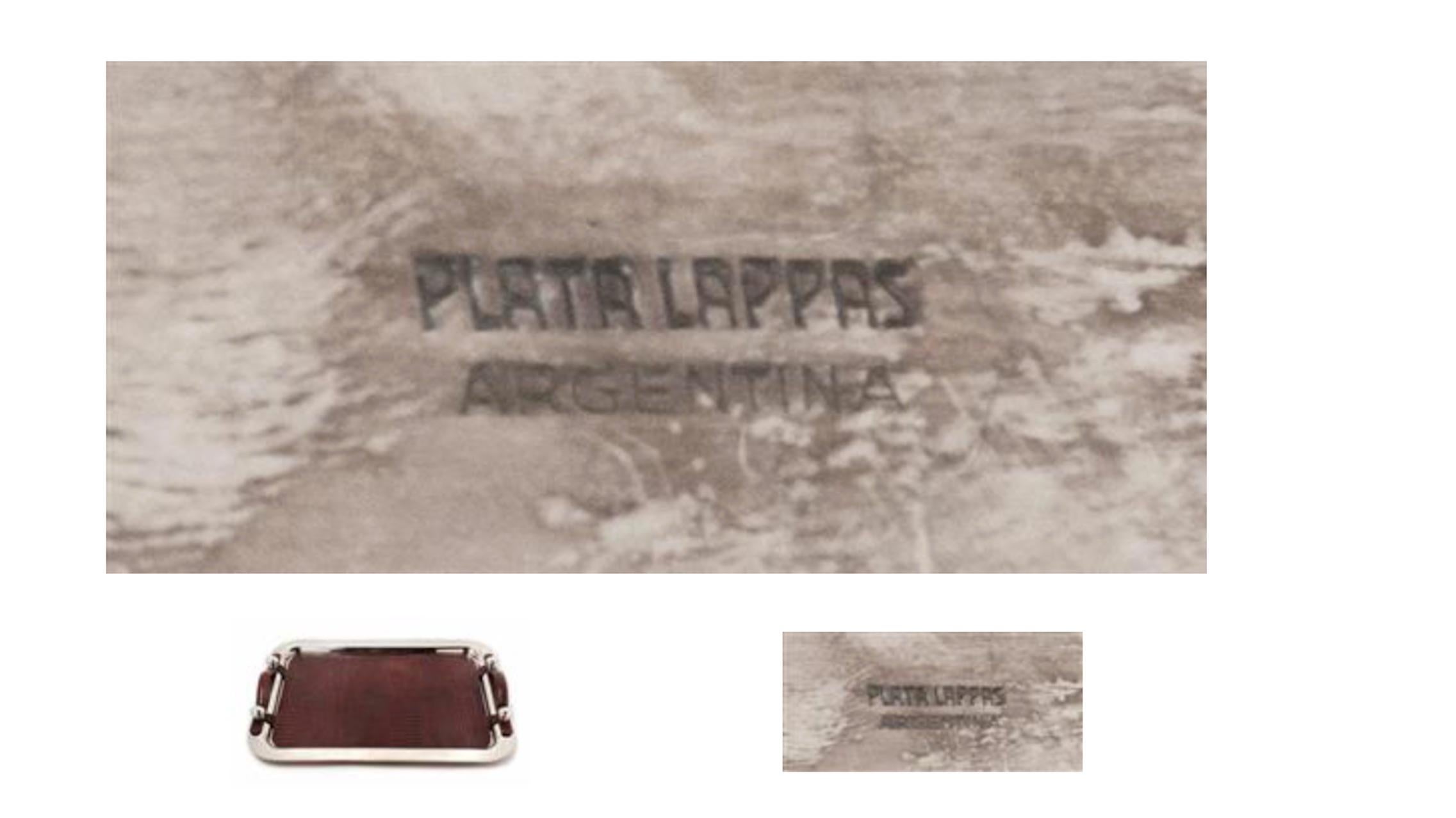 An Argentine silver plate and leather serving tray 
Plata Lappas, Buenos Aires, 20th century 
the tray with a spot-hammered finish. 
marked 'Plata Lappas/ Argentina' to the underside 
Width of tray 26 3/4 inches.