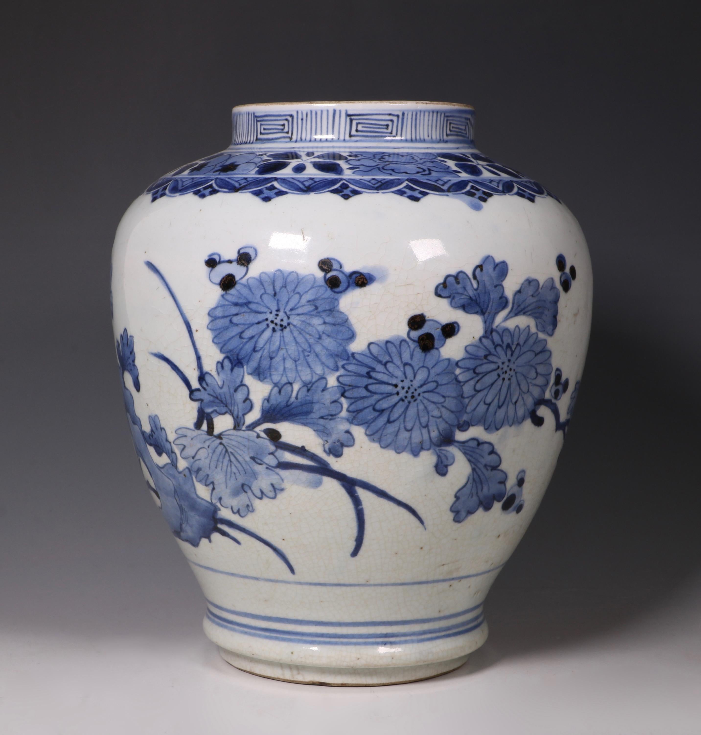 An Arita blue and white vase. Decorated with a flowering chrysanthemum issuing from rocks.

Japan ,circa 1660-1680.