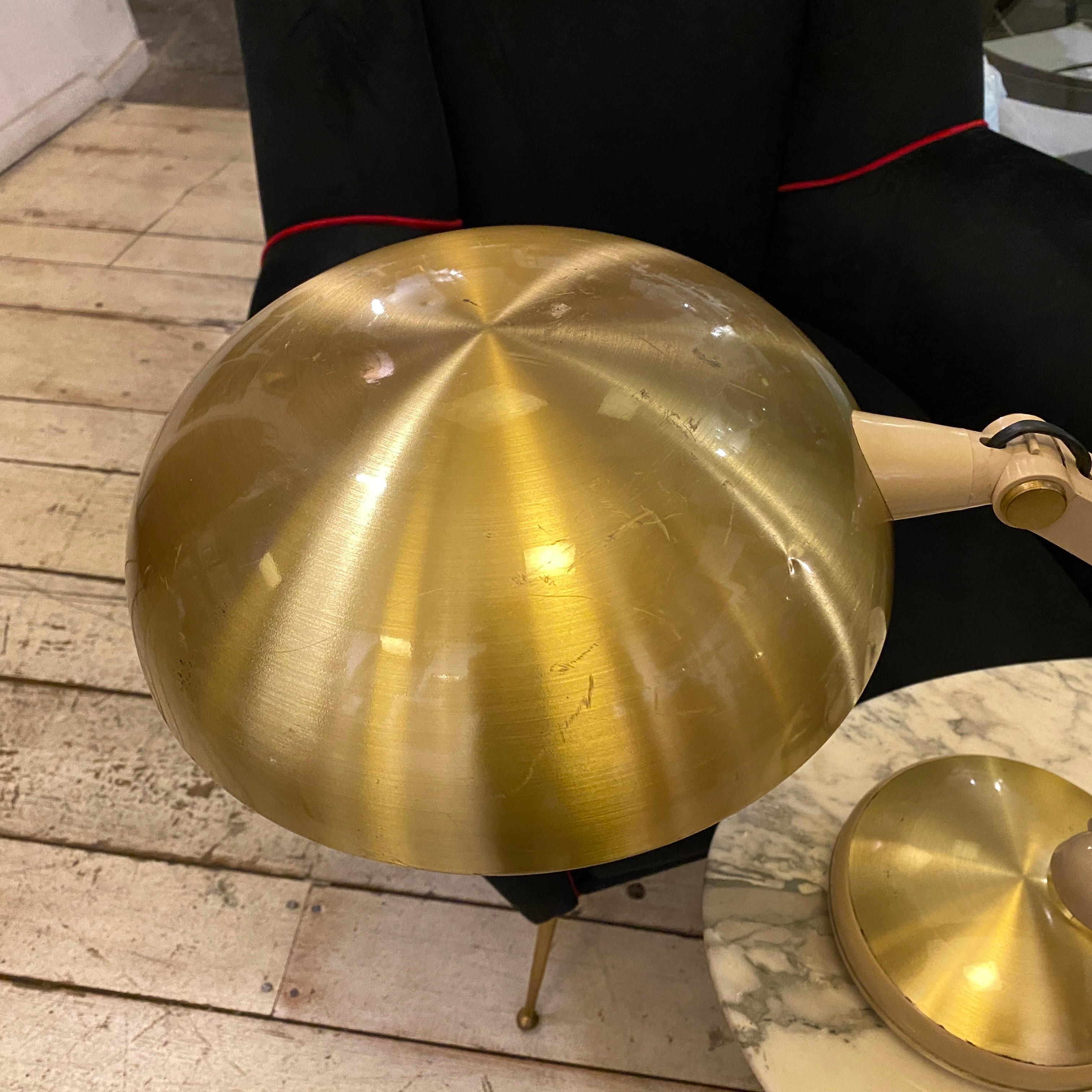 A rare table lamp made in Italy in the 1960s, plastic and gilded aluminum have signs of use and age as visible on the photos. It works 110-240 volts and need regular e27 bulb. It has on the bottom an holder for the hexagonal key that you need to