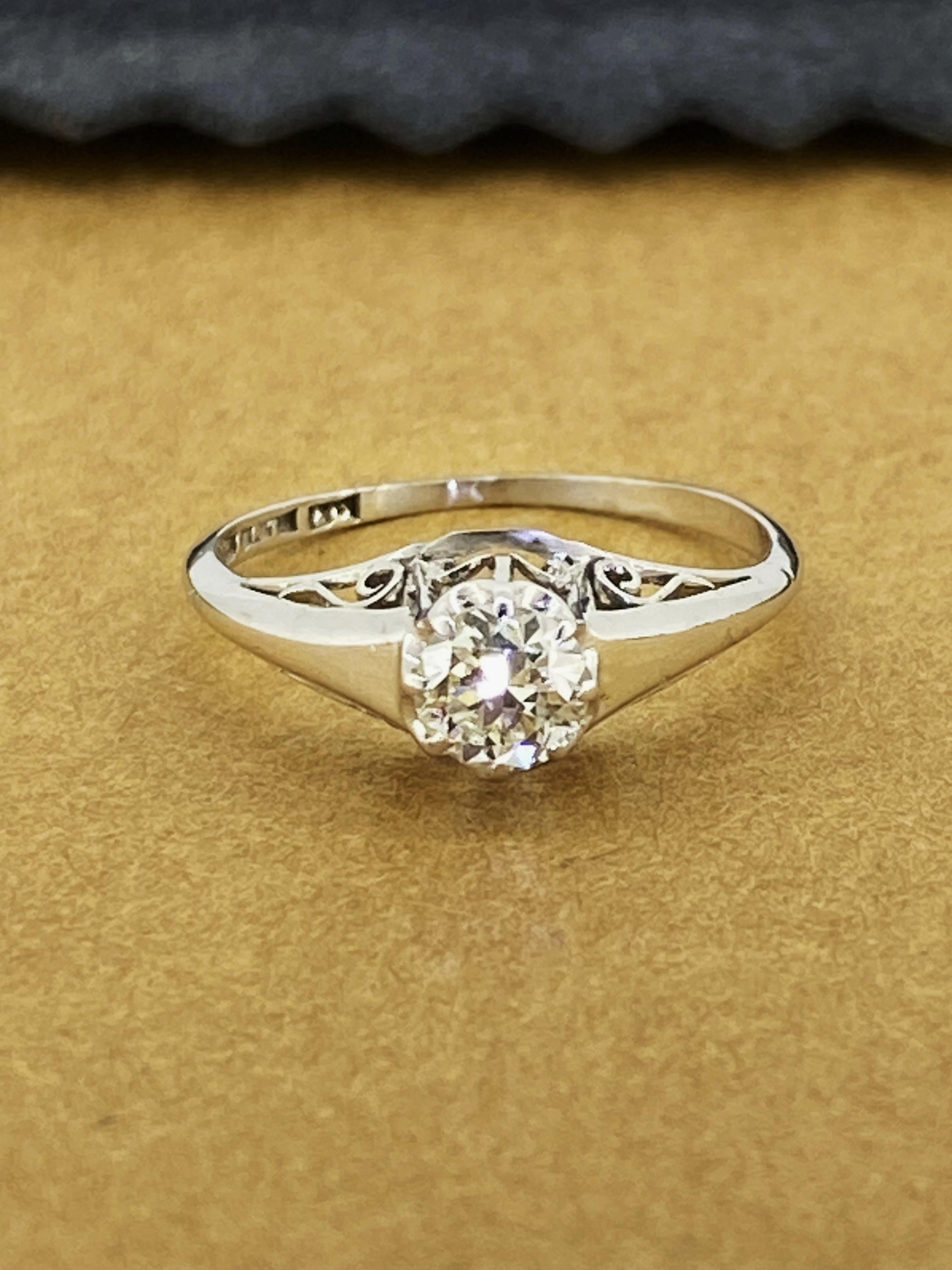 Of timeless Solitaire with Accents design 
this exquisite piece is dating back to an Art-Deco period – c1930’s

Centrally 8-claw set with an Old-European Cut Diamond
of 0.40ct approx. 
of G colour, VS clarity & sun-like brilliance, 
securely set in
