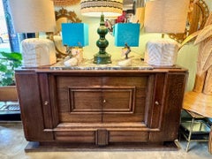 An Art Deco 1940s oak sideboard by Gaston Poisson with original marble top.