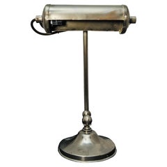 An Art Deco Adjustable Chrome Bankers Desk Lamp, on a circular base 1920's