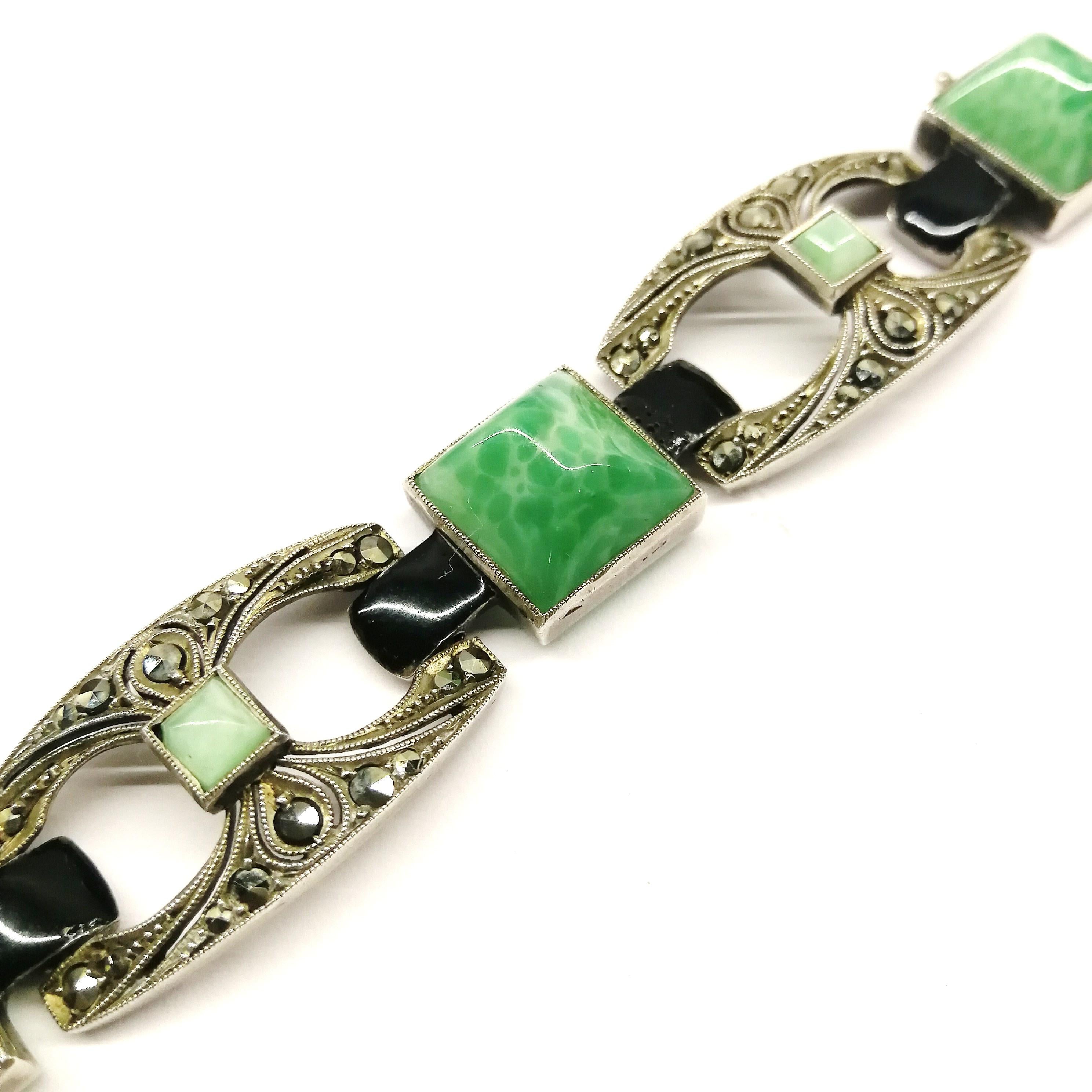 A very stylised Art Deco bracelet, both in style and colourway, semi precious stones , marcasite and black enamel stones set in sterling silver. The maker is unknown, but the bracelet originates from Germany, in the 1930s, where much of the high