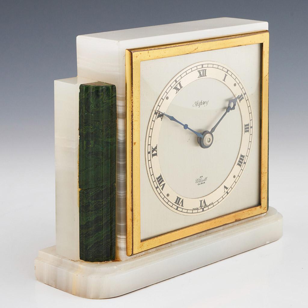 An Art Deco mantel clock by Asprey's of London. Marbled onyx with bevelled malachite to either side of an inset brass framed square clock face with Asprey and 'An Elliot Clock' inside Roman numerical clock face. Fully serviced. 

Dimensions: