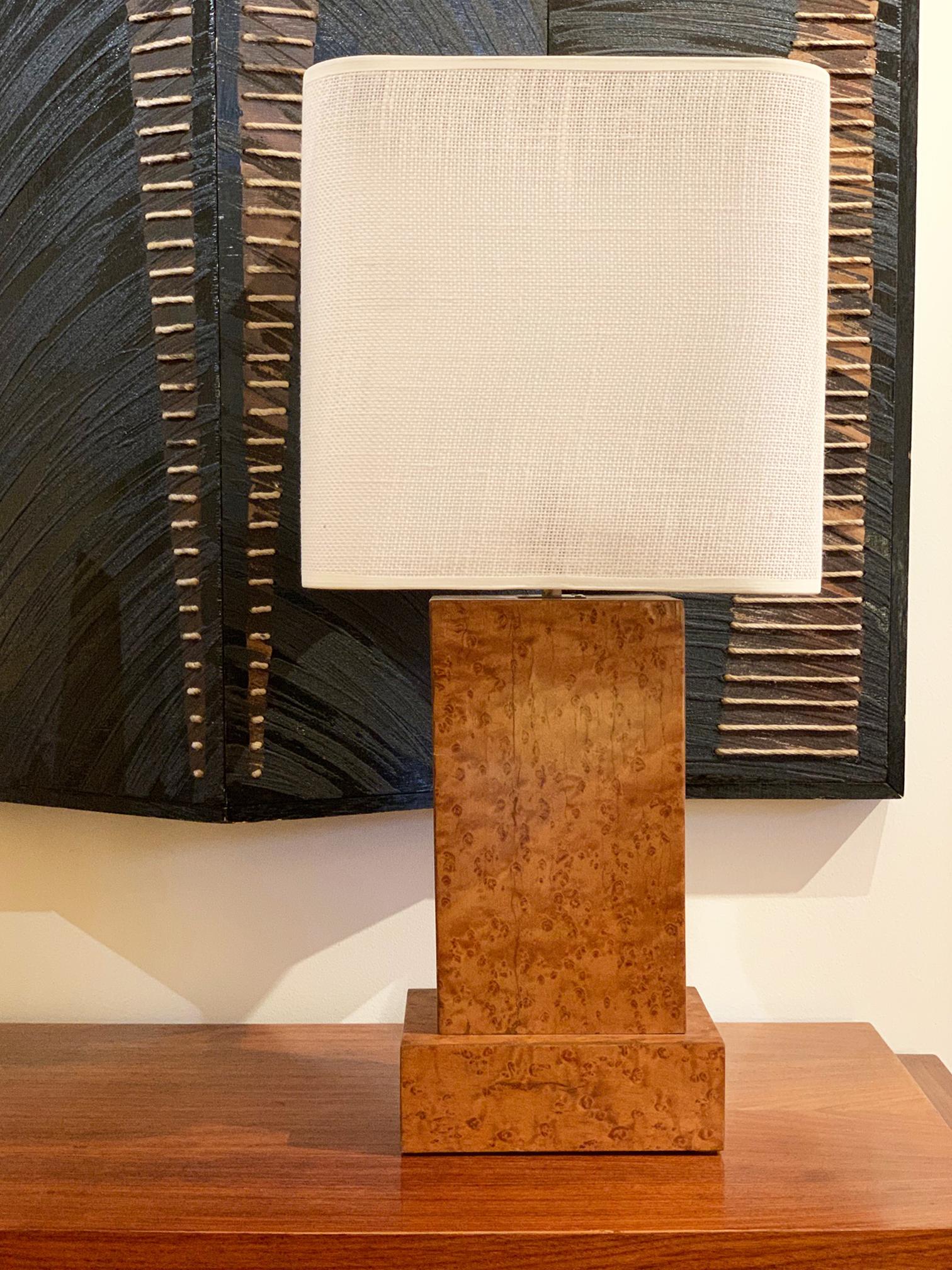 An Art Deco birdeye maple veneer table lamp
France, circa 1940
Including the shade: 66 cm high by 30 cm diameter
Wooden base only, ex fitting: 35 cm high by 20 cm diameter.
