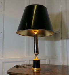 An Art Deco Brass and Black Leather Table Lamp   This is a very stylish lamp