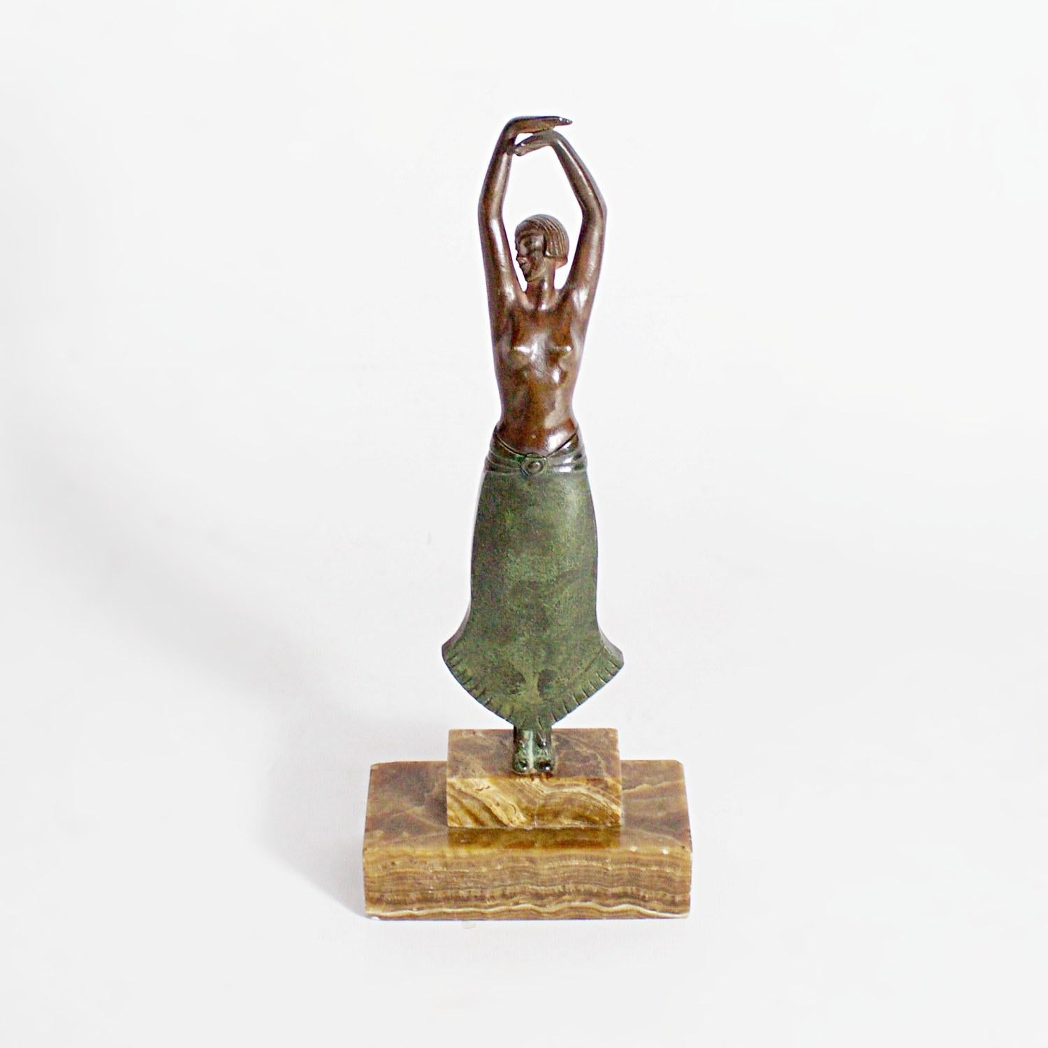 An Art Deco bronze sculpture by Pierre Laurel of a dancing, semi-nude lady, twirling with her green patinated dress billowing below her. Signed Laurel to bronze. Set over a marble base.

Artist: Pierre Laurel (1892-1962)

Dimensions: H 28cm, W