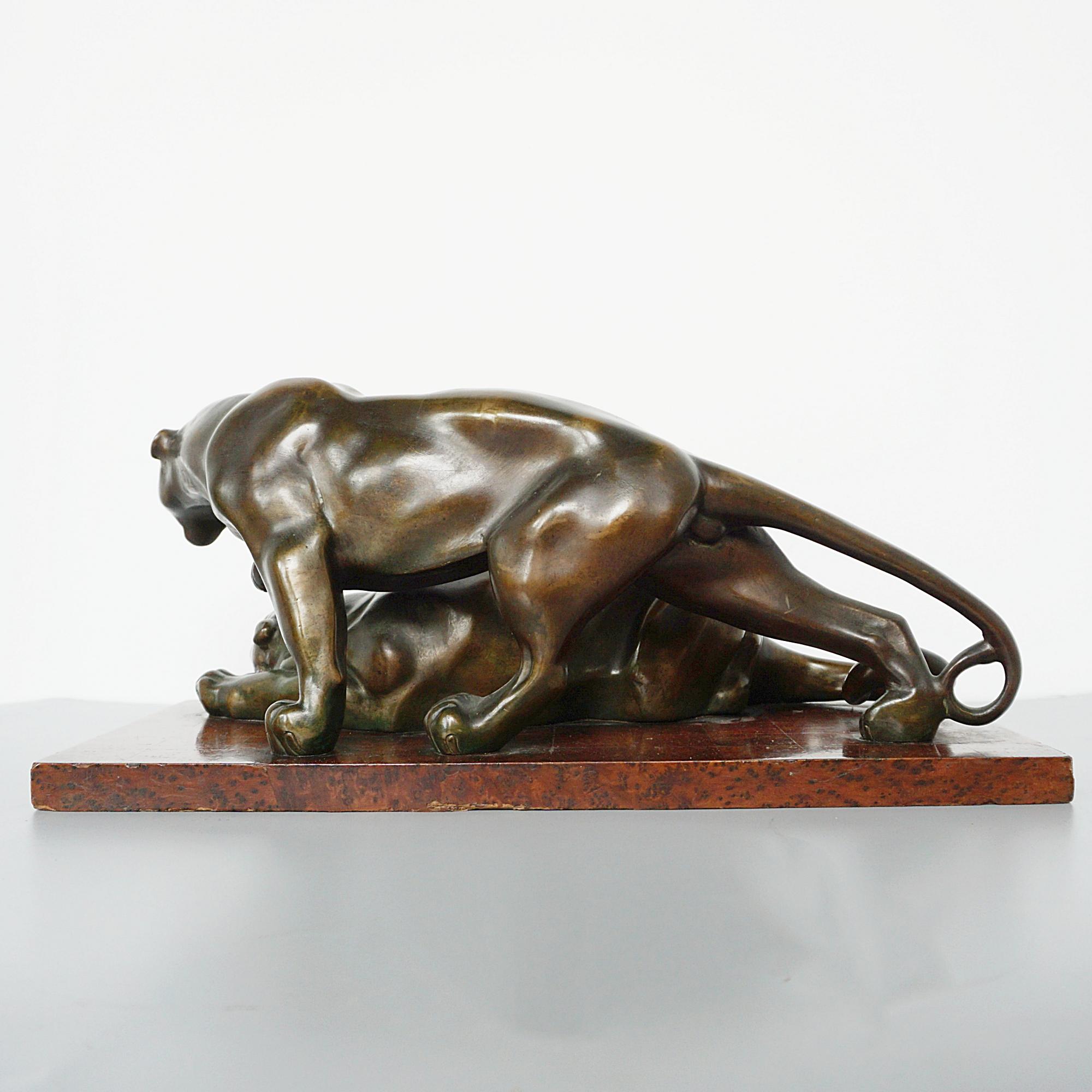 Early 20th Century An Art Deco Bronze Sculpture Group Depicting Two Prowling Panthers