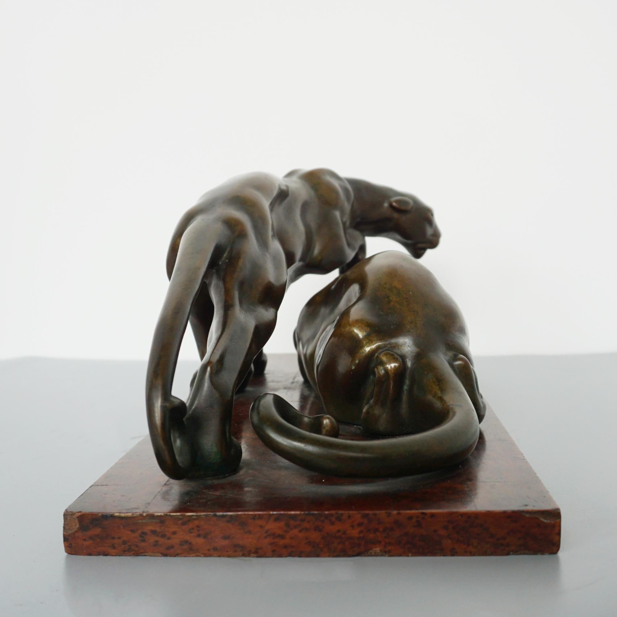 An Art Deco Bronze Sculpture Group Depicting Two Prowling Panthers 2