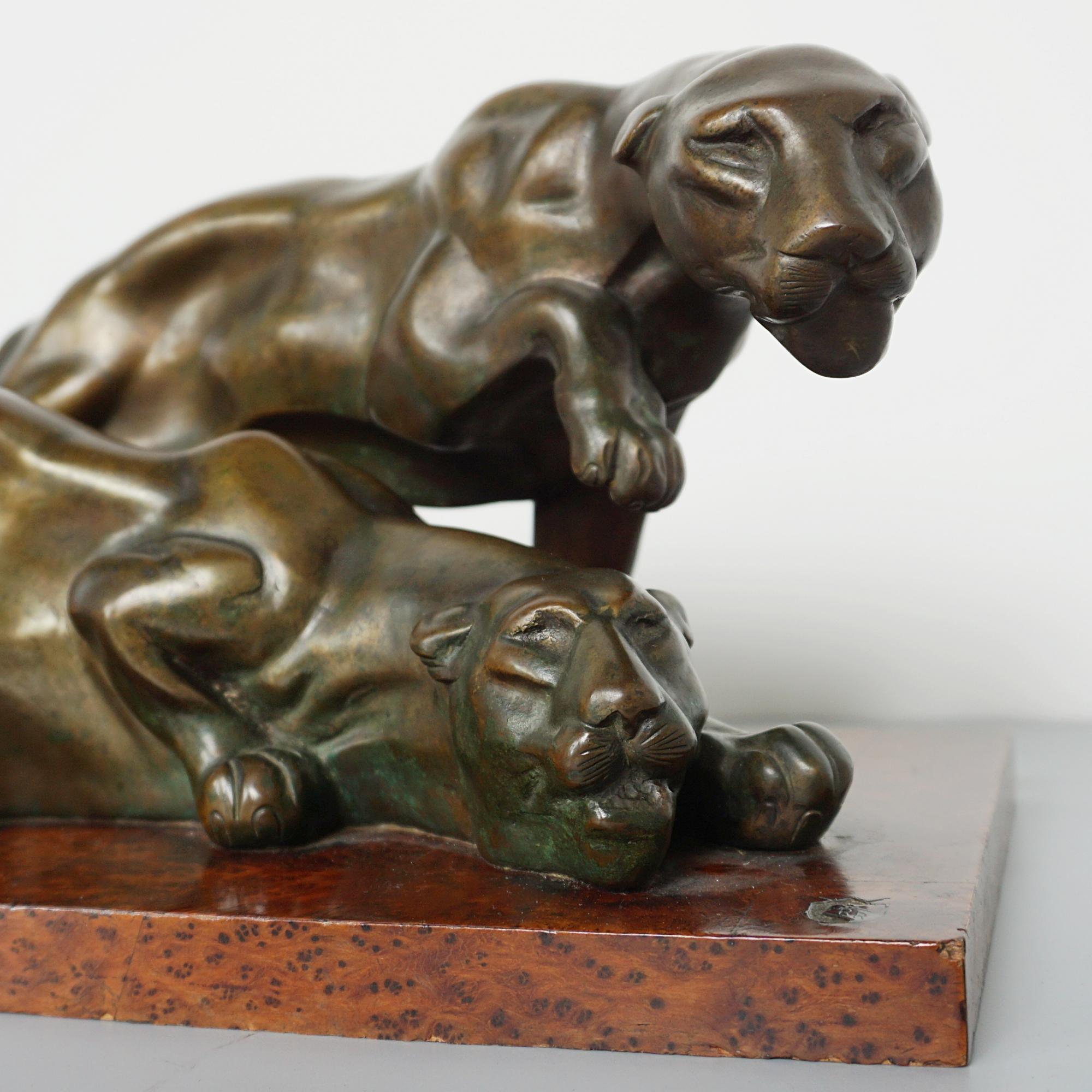 An Art Deco Bronze Sculpture Group Depicting Two Prowling Panthers 3