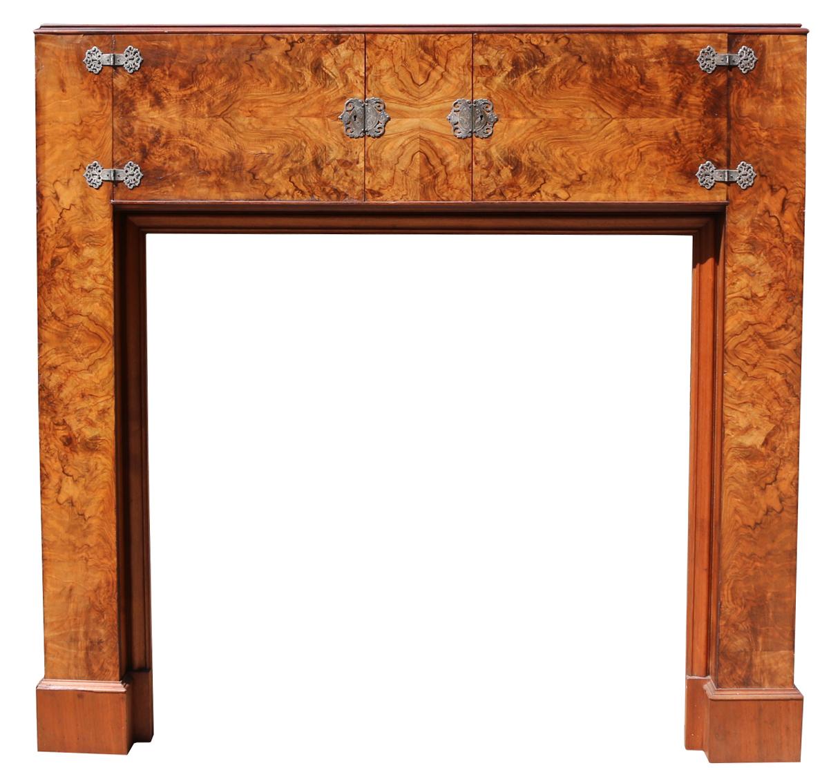 An unusual model, only the second we have seen and bought in the last decade. Fitted with two cupboards to the frieze. Each cupboard backed with mirror glass. Originally fitted with glass shelves. We do not have keys for the locks.

This fire