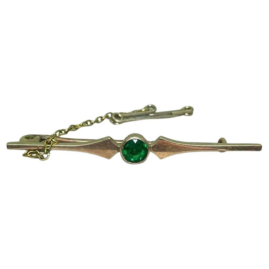 An Art-Deco c1930's Gilson Synthetic Emerald 9K Yellow Gold Bar Brooch For Sale
