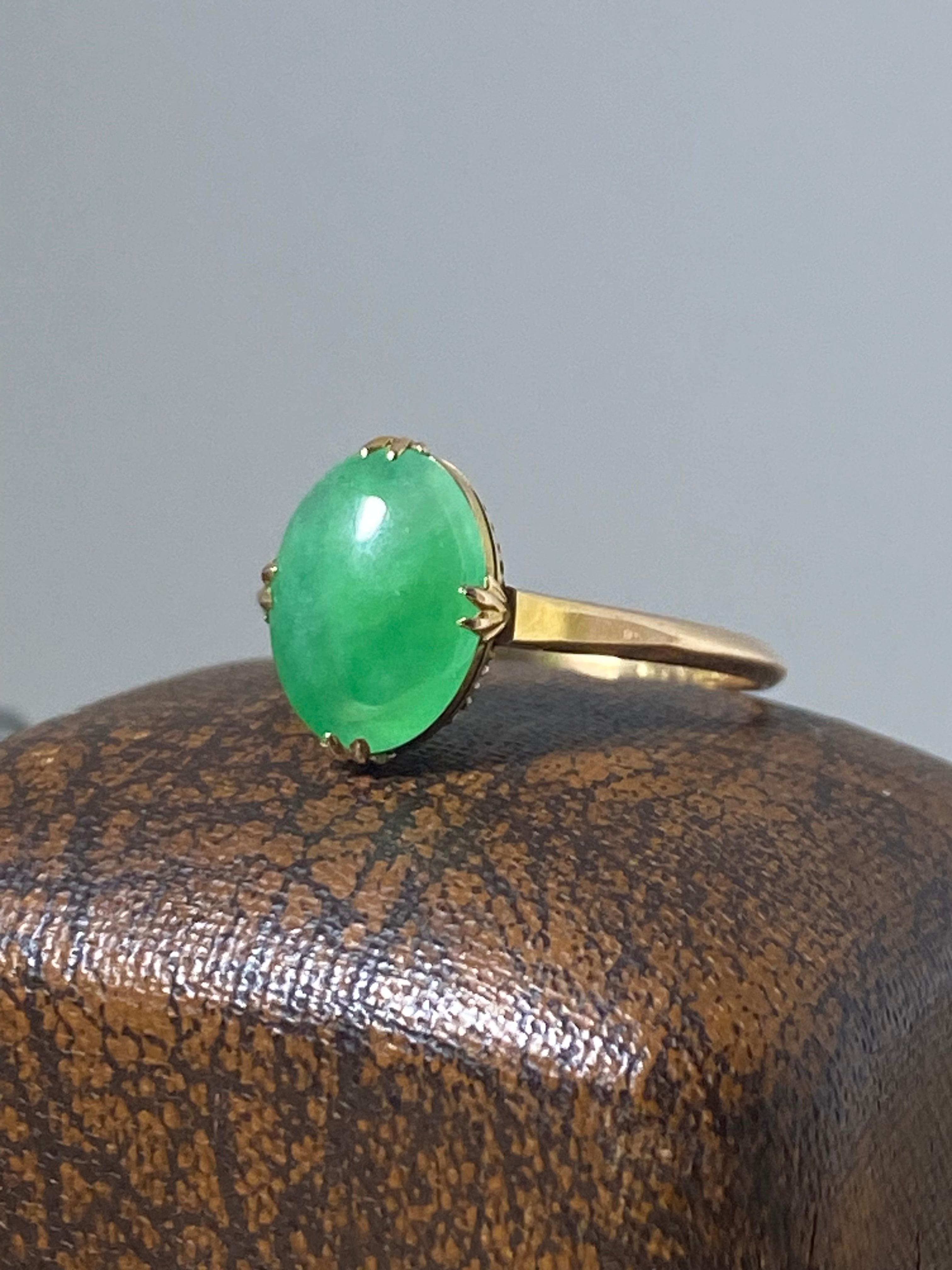 This Magnificent Piece of Jewellery 

is handmade, 

dating from Art-Deco period - circa 1930's & 

yet is in excellent condition.



Centering a top quality type A  

Natural Jadeite of 11mm x 8.5mm 

oval cabochon, 

of fine & distinctive medium