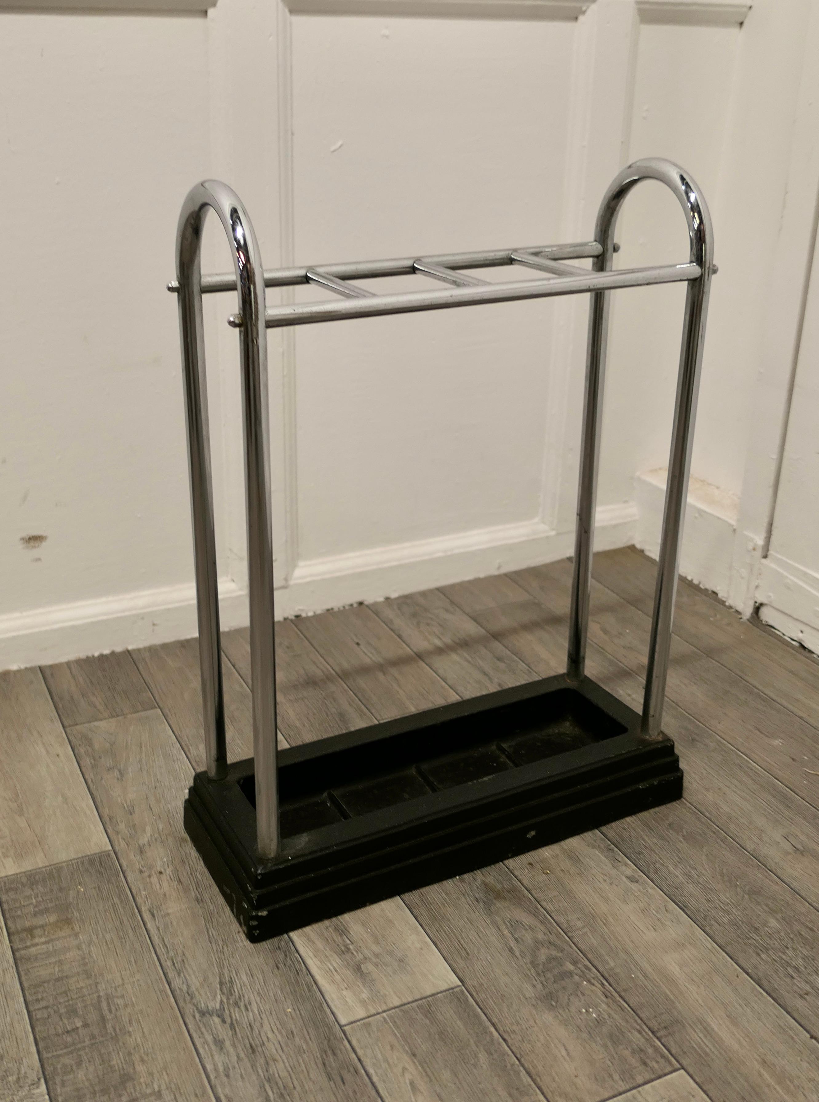 An Art Deco chrome and cast iron stick stand or umbrella stand

A charming piece made in Chrome, the top is divided into 4 sections to hold either Walking Sticks or Umbrellas, 
The heavy iron base of the stand is stepped in the Odeon style 
The