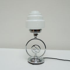 An Art Deco Chromed Lightning Bolt Table Lamp with Glass Globe Shade