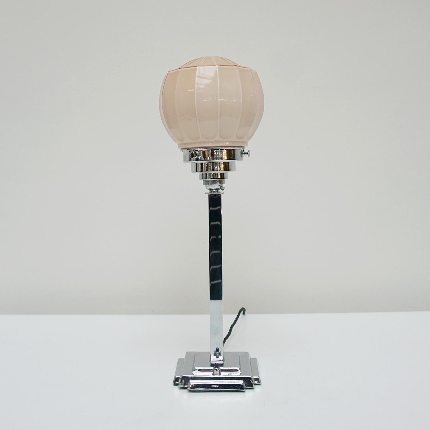 An original Art Deco table lamp. Chromed stem with ornate peach pink glass globe shade.

Dimensions: H 46cm W 12cm 

Origin: English

Item Number: J313

All of our lighting is fully refurbished, re-wired, and re-chromed with some replacement parts. 