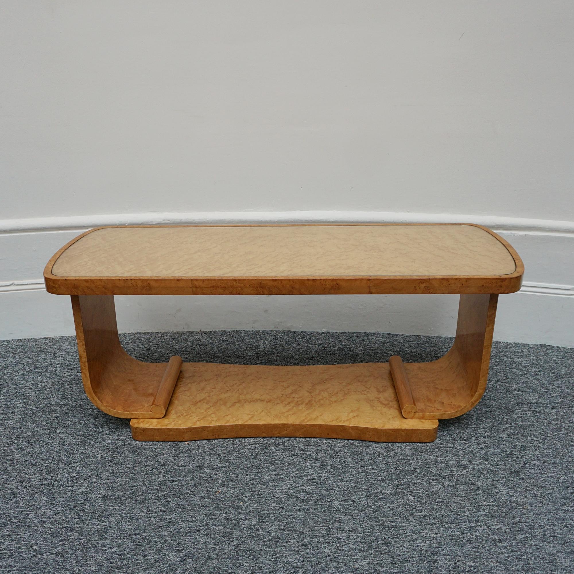An Art Deco coffee table by Harry & Lou Epstein. Birdseye maple veneered with glass top. 

Dimensions: H 49cm W 122cm D 45.5cm

Origin: English

Date: Circa 1930

Item Number: 1011234

The Epstein company was founded in London during the 1890’s by