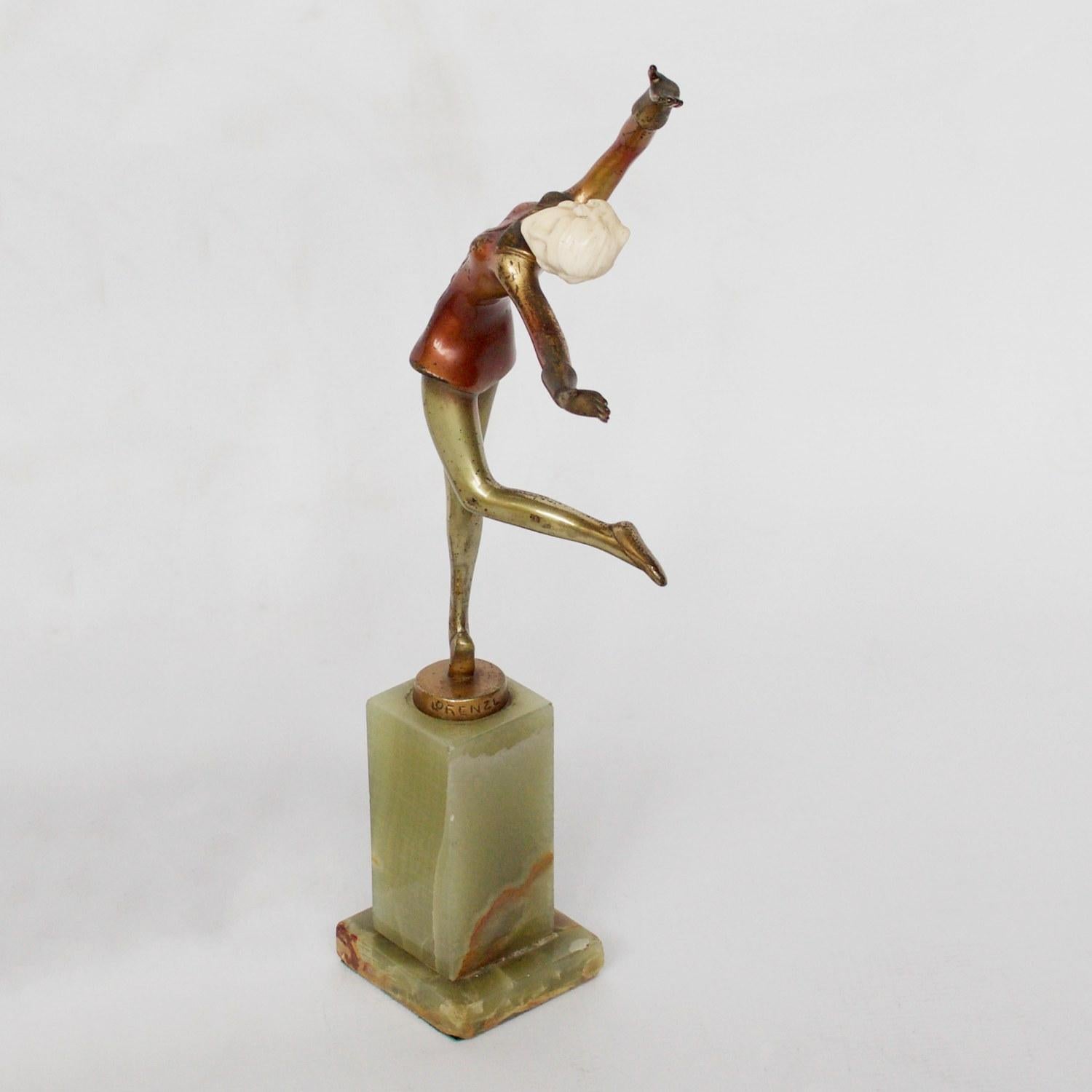 An Art Deco, cold painted bronze figure of an elegant dancer dressed in a buttoned red jacket, arms out stretched in an extravagant pose. Hand carved ivory head, raised on a green onyx base. Original enamel patination. 

Signed Lorenzl to