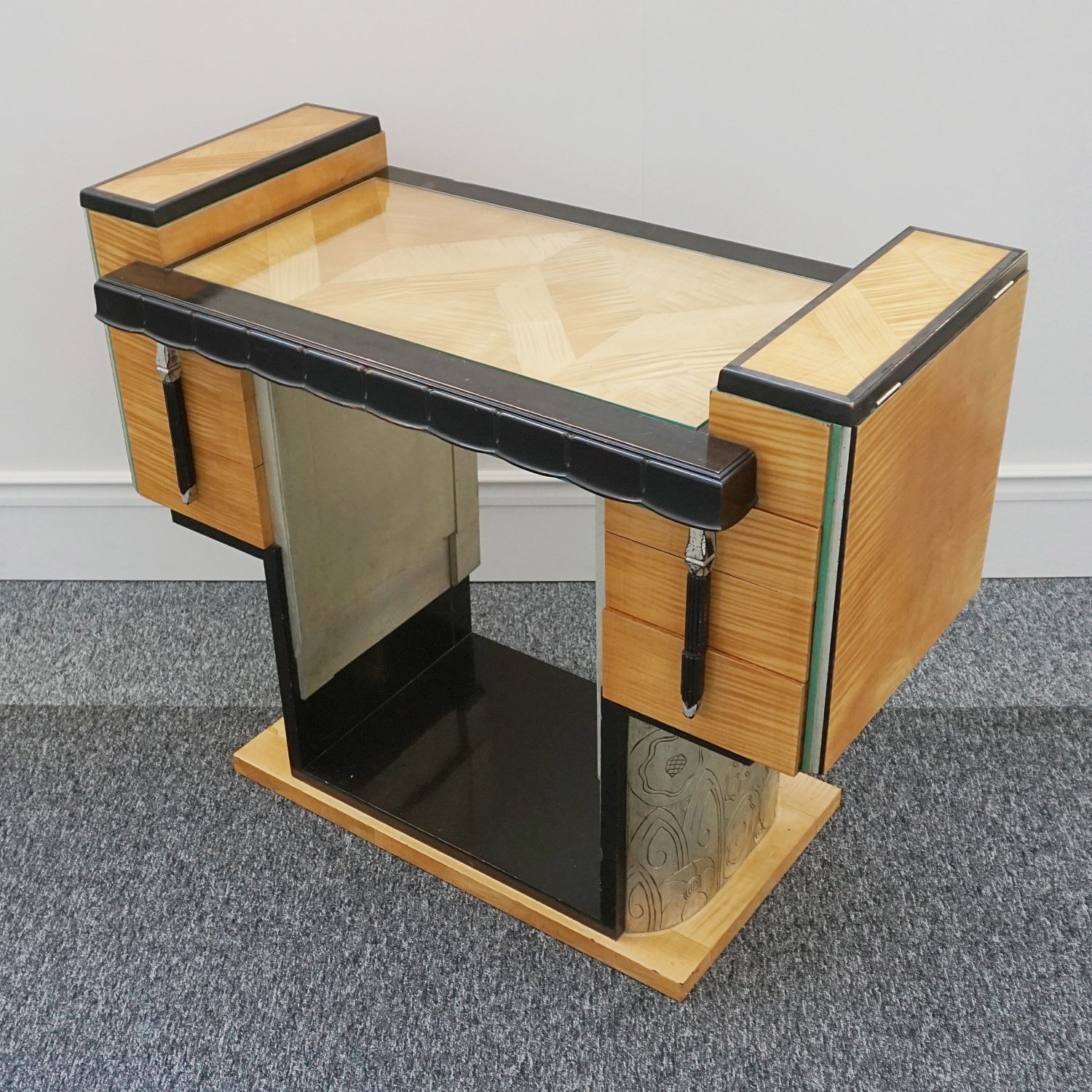 An Art Deco Console table by Serge Ivan Chermayeff (1900-1996) for Waring & Gillows. Satin birch veneered with ebonised banding. Original ebonised and silver painted handles. Three deep drawers to either side with two partitioned compartments to