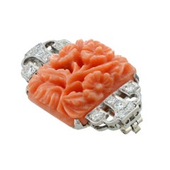 An Art Deco coral and diamond brooch