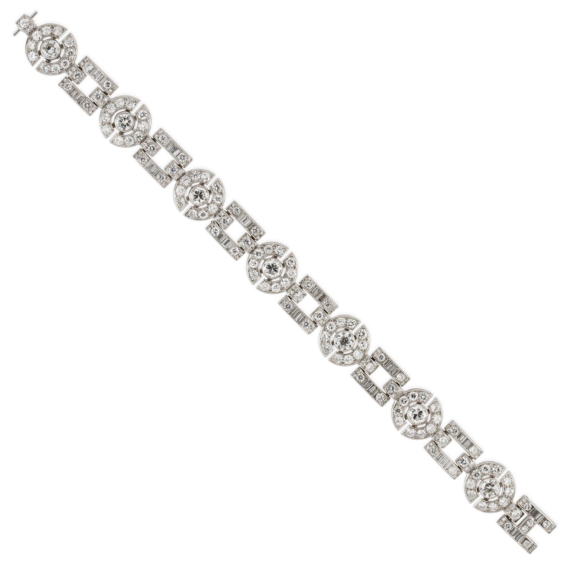 An Art Deco diamond bracelet, consisting of seven old European-cut diamonds, rubover-set within circular-shaped openwork links encrusted with smaller old European and swiss cut diamonds, alternating with square shaped openwork links set with