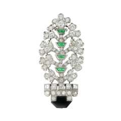 An Art Deco Diamond, Onyx And Emerald Giardinetto Brooch