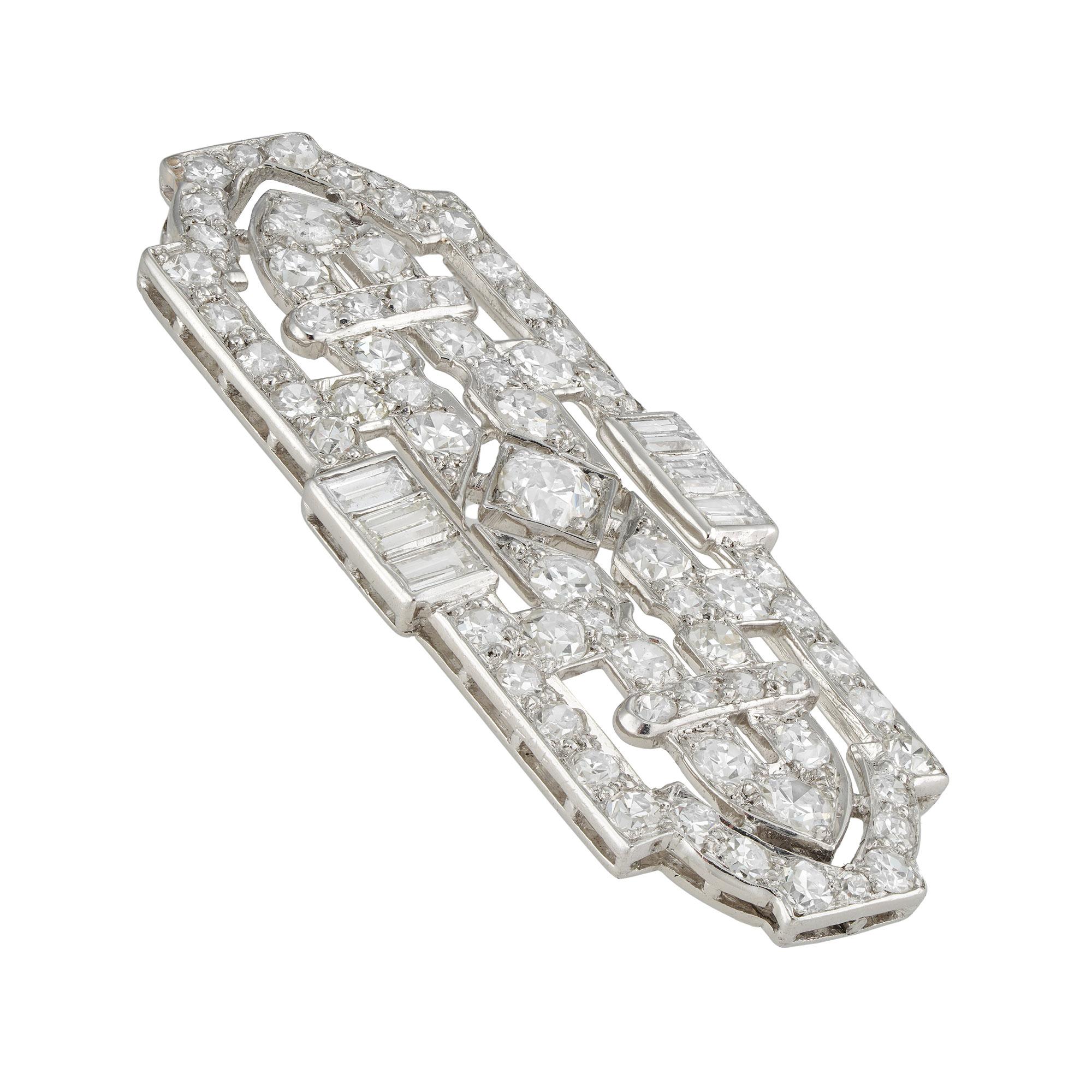 An Art Deco diamond plaque brooch, the openwork geometric designed plaque, set with old brilliant and baguette-cut diamonds estimated to weigh 2.4 carats in total, mounted in platinum with white gold brooch fitting, unsigned, bearing inventory