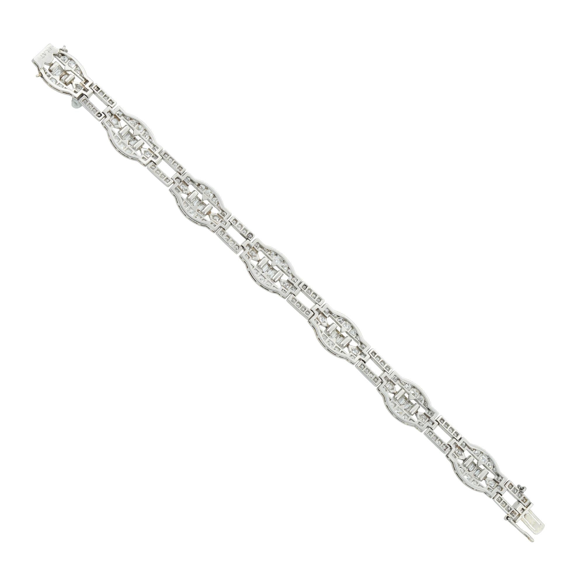 An Art Deco diamond-set bracelet, comprising of seven navette shape open panels with baguette-cut diamonds to the centre surrounded by eight-cut diamonds with an open rectangular eight-cut diamond-set links inbetween, estimated to weigh a total of