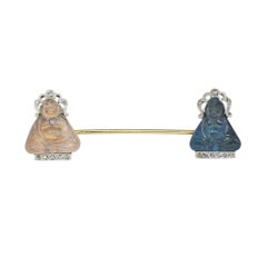 An Art Deco Double Buddha Jabot Pin