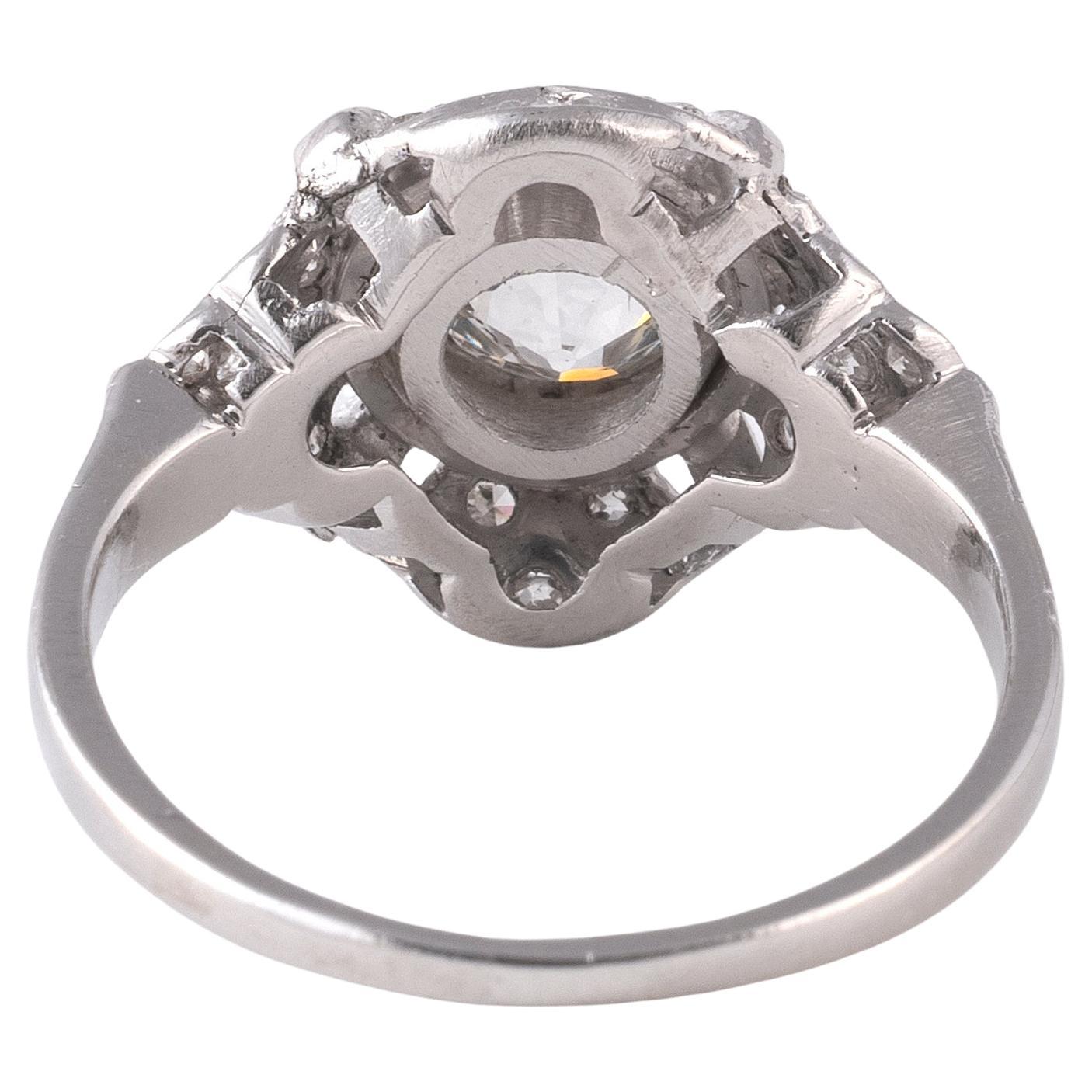 Centered with a old cut diamond weighing approx. 1 .2ct to an openwork bezel and shoulders, mounted in 18kt white gold
circa 1935
Size 5 3/4
Weight 4.5gr.