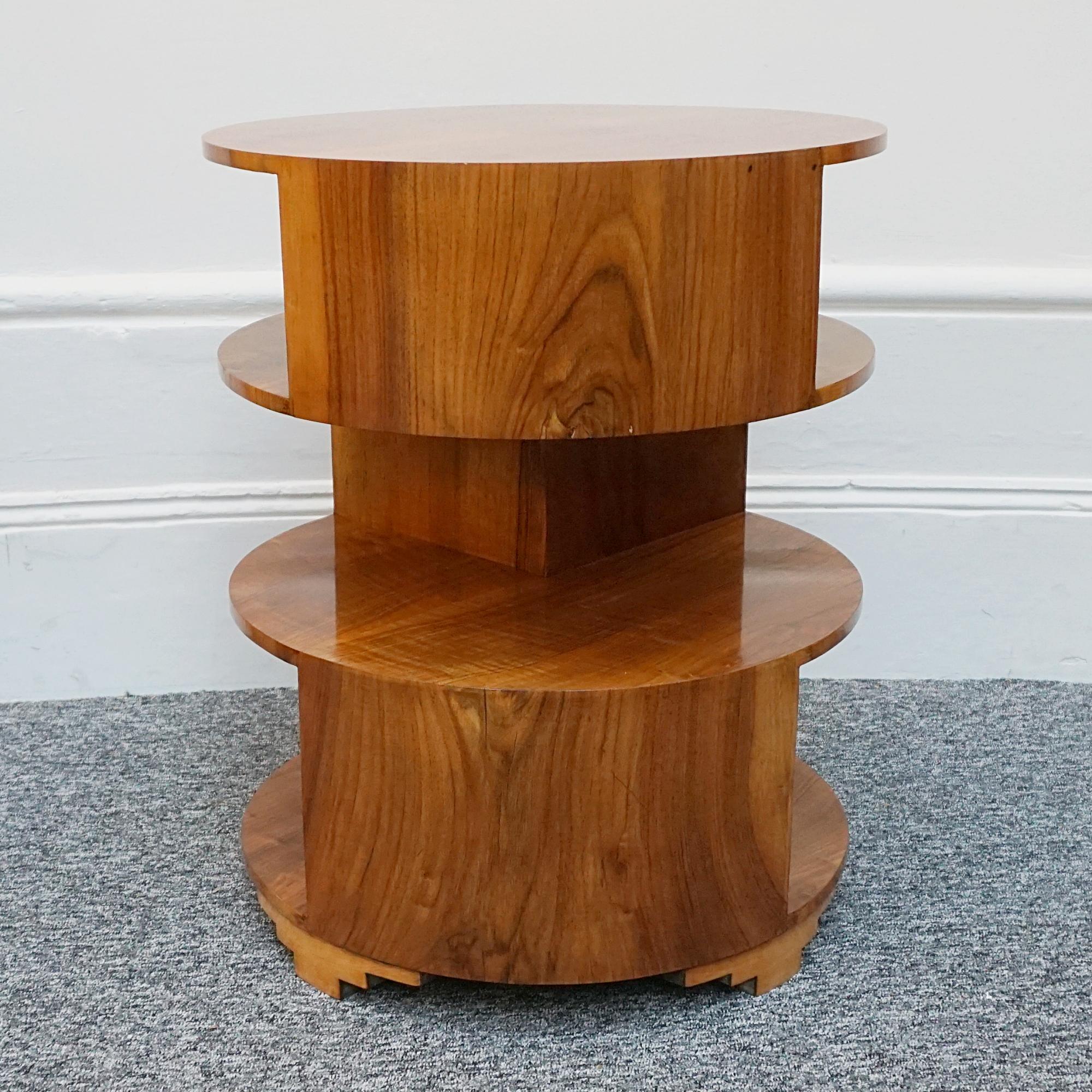 An Art Deco figured walnut circular table with three graduated shelves.

Dimensions: H 62cm D 50cm 

Origin: English

Date: Circa 1935

Item Number: 0812234