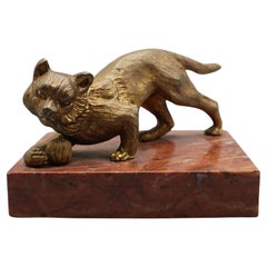 An Art Deco Gilt Bronze Paperweight Set Over A Marble Plinth