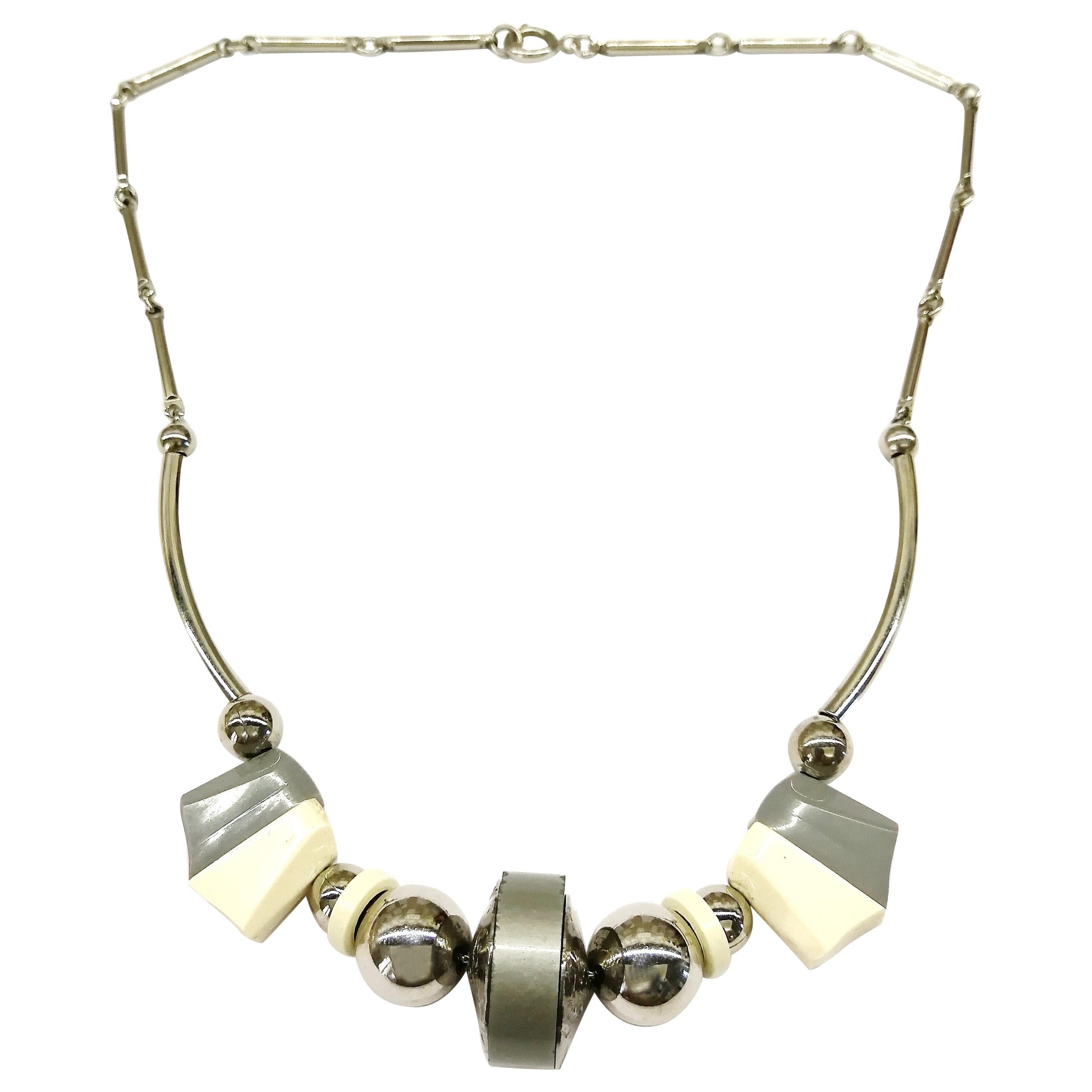 An Art Deco grey and cream Bakelite, chrome metal necklace, Germany, 1930s