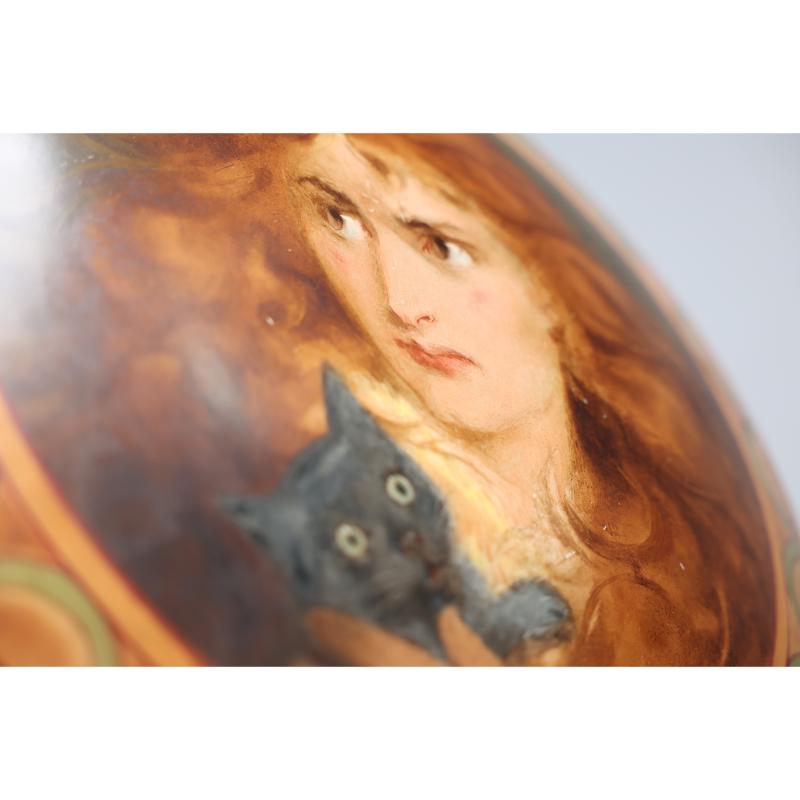 An Art Deco hand painted plate depicting Lois the Witch holding a black cat. 2