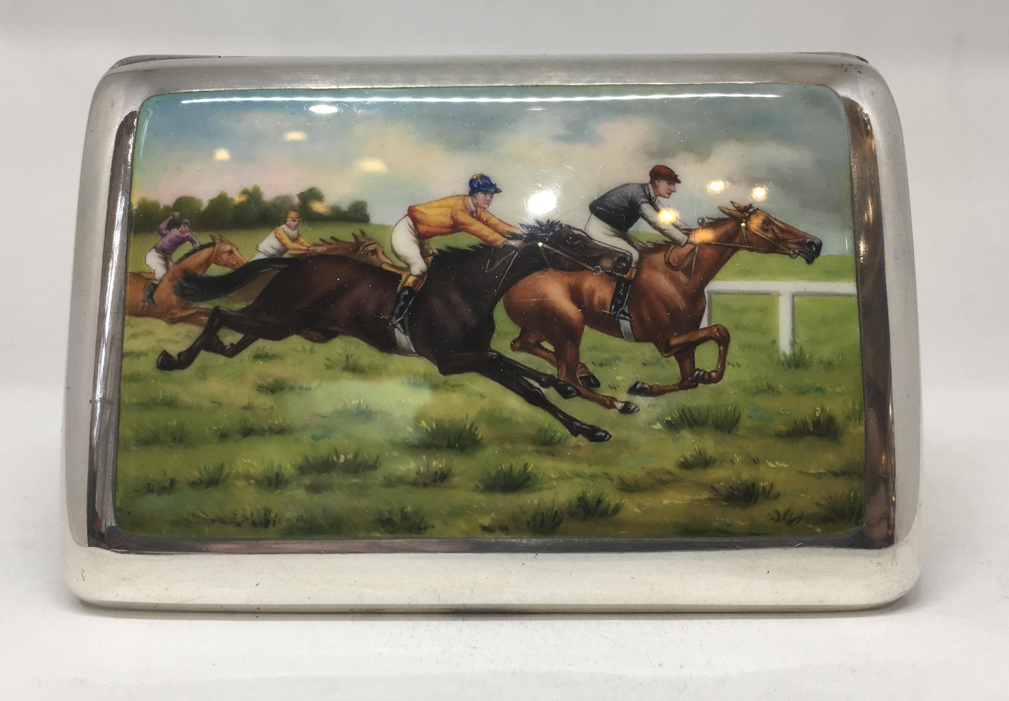 A rare and wonderful horse racing themed, German silver cigarette case, circa 1920.

A delightful scene, with two vying horses in mid gallop, to further runners in the distance. Wonderfully painted, the colors extremely vibrant.

The bridal on both