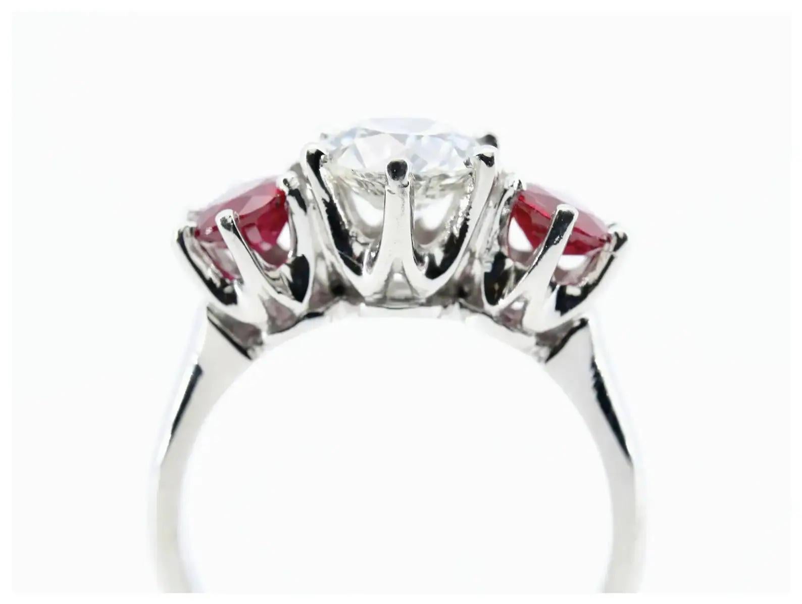 Round Cut An Art Deco inspired diamond, and ruby dome style ring in platinum.  Centered by For Sale