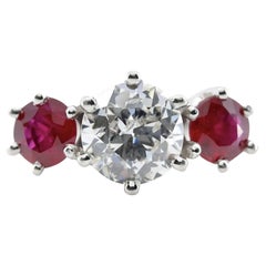 Antique An Art Deco inspired diamond, and ruby dome style ring in platinum.  Centered by