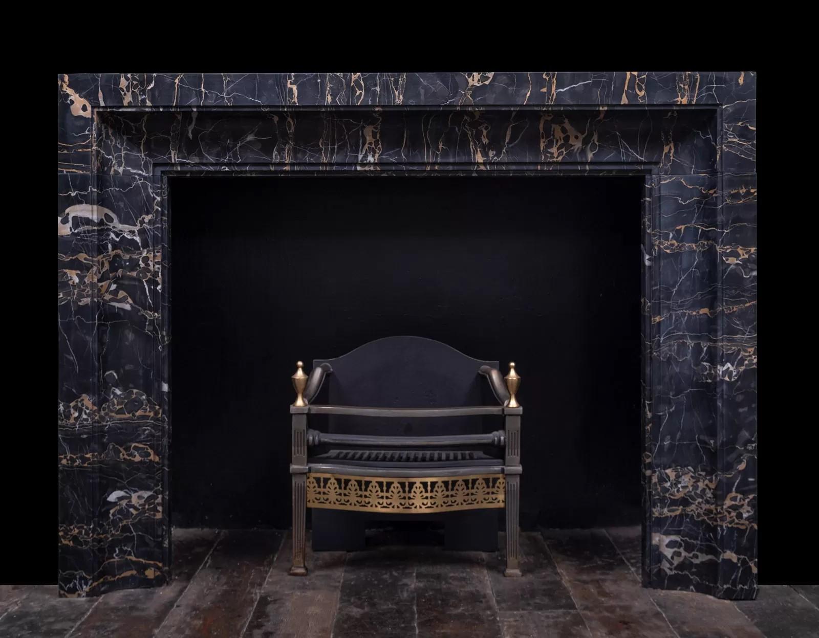 An Art Deco inspired fireplace surround made in stunning and semi-precious Nero Portoro marble by Ryan and Smith.

With vibrant markings that flow in the direction of the fireplace opening.

Nero Portoro is an Italian marble extracted only in Porto
