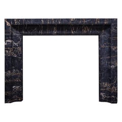 An Art Deco inspired mantel in semi-precious Nero Portoro by Ryan and Smith