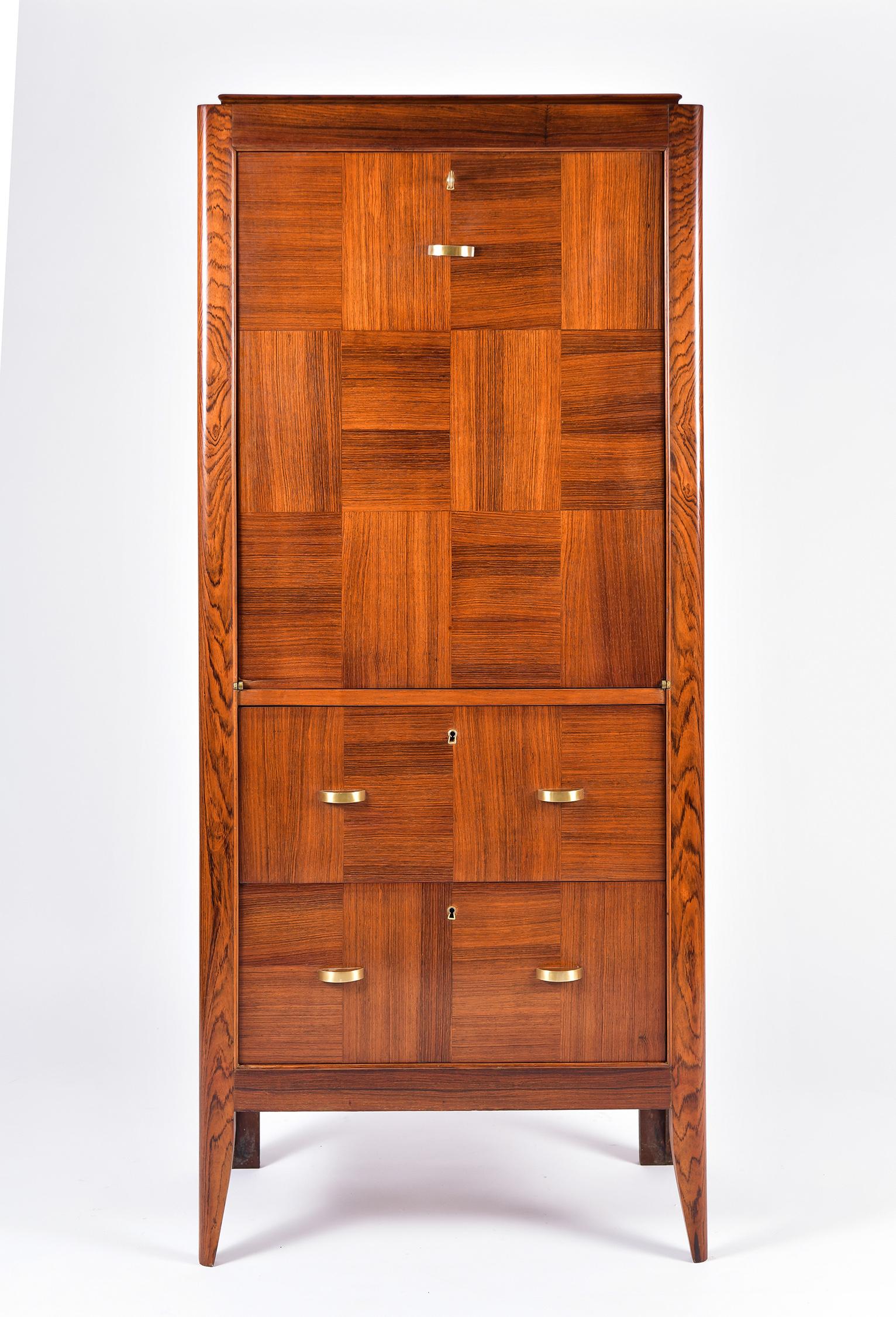 An Art Deco kingwood cocktail cabinet, attributed to Alfred Porteneuve (1896-1949)
The kingwood parquetry facade consisting of two drawers and an abattant, with brass handles and key, on tapered legs.
France, circa 1930.